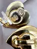 boucles d'oreilles clip yves saint laurent motif coeur doré et pierre rose