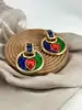 boucles d'oreilles pendqntes clip yves saint laurent en métal doré