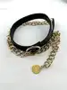 ceinture en cuir noir et métal doré