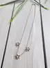 collier maille forçat orné de 3 motifs fleur chacune sertie de 6 rubis et 1 diamant or 750 millième (18 ct) 6,77g