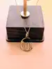collier or orné d'un pendentif allah forme lune & étoile ajouré or 750 millième (18 ct) 1,48g