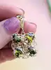 pendentif filigrane serti de 4 péridots ovales or 750 millième (18 ct) 4,35g