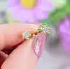boucles d'oreilles or puces chacune sertie d'un petit diamant d'environ 0,05ct or 750 millième (18 ct) 1,13g