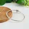 bracelet pandora jonc fermoir cœur infini moments argent 925 millième (22 ct) 9,18g