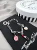 bracelet thomas sabo avec 3 charms ( rouge à lèvres, coeur, flacon de vernis à ongles ) argent 925 millième (22 ct) 16,46g