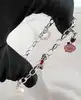 bracelet thomas sabo avec 3 charms ( rouge à lèvres, coeur, flacon de vernis à ongles ) argent 925 millième (22 ct) 16,46g