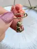 broche épingle orné d'un charm chat or 750 millième (18 ct) 1,39g