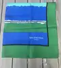 foulard balenciaga en soie vert et bleu à motif géométrique