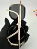 lunettes de soleil prada spr20x avec des verres noirs