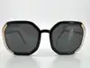 lunettes de soleil prada spr20x avec des verres noirs
