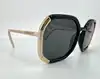 lunettes de soleil prada spr20x avec des verres noirs