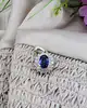 pendentif maguerite en or blanc centré d'un beau saphir entouré de 2 rangs de diamants or 750 millième (18 ct) 2,31g
