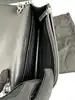 sac bandoulière yves saint laurent kate en cuir lisse noir avec pompon et finitions argentées
