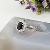 bague marguerite centrée d'une pierre bleue entourée d'oxydes t54 argent autre 3,03g