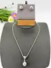 parure en argent collier avec un pendentif double boule et boucles d'oreilles assorties argent 925 millième (22 ct) 13,77g