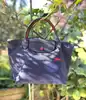 sac à main longchamps le pliage s en toile bleue