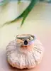 bague croisée en 2 ors centrée d'un saphir et 2 petits diamants or 750 millième (18 ct) 2,65g
