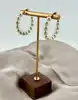 boucles d'oreilles créoles ornées de perles synthétique