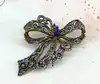broche noeud ornée d'oxydes en métal