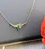 collier maille forçat centré d'un pendentif orné de 3 émeraudes taille navette or 750 millième (18 ct) 2,42g