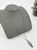 collier thomas sabot maille gourmette avec pendentif plume argent 925 millième (22 ct) 11,69g