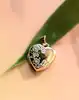 pendentif "boîte photo" forme coeur en 2 ors or 750 millième (18 ct) 1,35g
