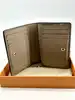 portefeuille compact louis vuitton cléa en cuir mogogram de couleur tourelle
