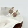 23090405 boucles d'oreilles ronds motif fleur orné d'oxydes