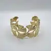 31222764 bracelet manchette motif feuille de ginkgo en acier doré