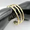 31225760 emsemble bracelet motif bamboo en acier doré