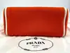 sac à main prada ouverture en toile orange et cuir noir