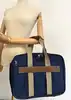 sacoche porte-documents/sac de voyage lancel bleu marine en toile et cuir avec cadenas et clés