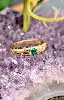 bague bombée en or centrée d'une petite émeraude taille rond or 750 millième (18 ct) 5,09g