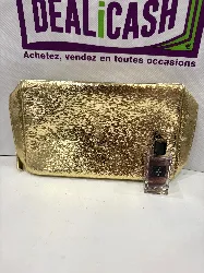 trousse de toilette dorée yves saint laurent