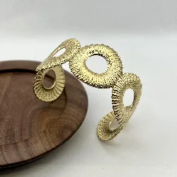 31232262 bracelet jonc /manchette métaillon avec motif en acier doré largeur 3