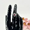 bague en argent avec une pierre rouge au centre entouré de strass noirs argent 925 millième (22 ct) 2,31g