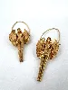 boucles d'oreilles givenchy sculpturales en métal doré collection zodiaque vierge