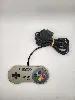 console nintendo super nes snes avec une manette