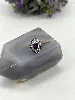 bague centrée d'une pierre bleue entourée d'oxydes en métal argenté t51
