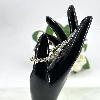 bracelet rivière serti d'oxydes en acier doré l16 /19 cm