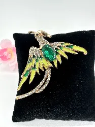 broche phénix en métal doré clair et émaillé ornée des strass blancs et vert
