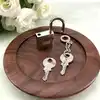 cadenas hermès argenté avec 2 clès