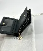 portefeuille coach à bouton pression en cuir noir