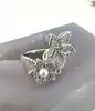 bague apm monaco fleurs et perle, pavée de zirconiums  t52 argent 925 millième (22 ct) 3,53g