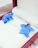 boucles d'oreilles baccarat starlet bleu en cristal et or jaune or 750 millième (18 ct) 16,38g