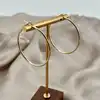boucles d'oreilles créoles en acier doré