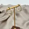boucles d'oreilles créoles en acier doré ornées de perles synthétiques