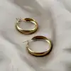 boucles d'oreilles créoles larges en acier doré
