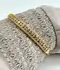bracelet jonc orné d'oxydes en métal doré