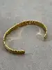 bracelet jonc ouvert motif feuille en métal doré